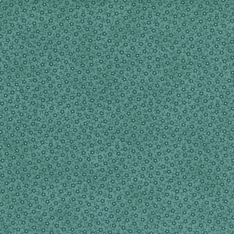 Mottled teal fabric covered in tiny dark teal flowers with white spots