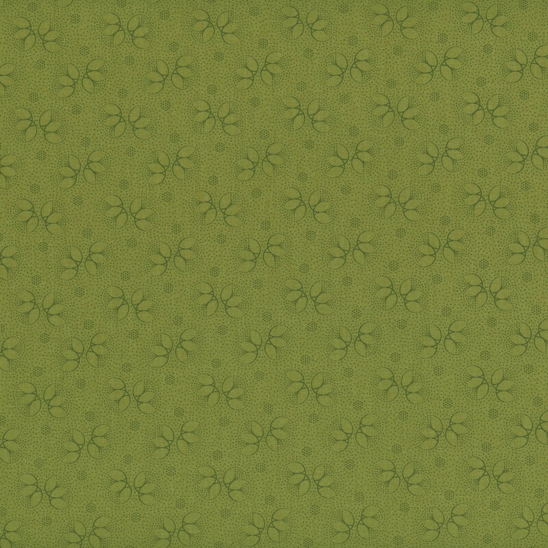 Green tonal fabric with dark green outlines of floral accents and dots