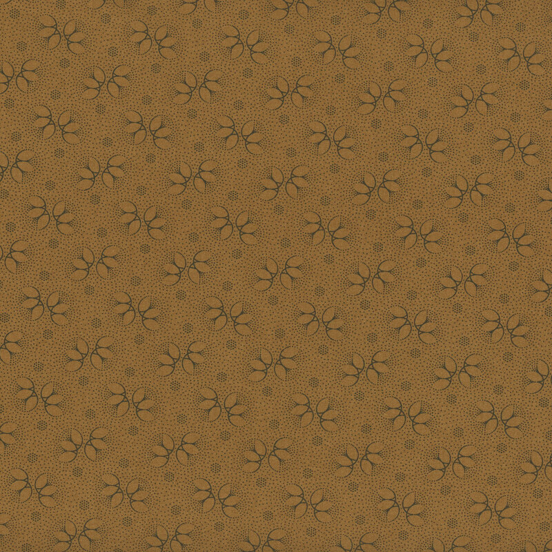 Brown fabric with outlines of black floral accents and dots throughout