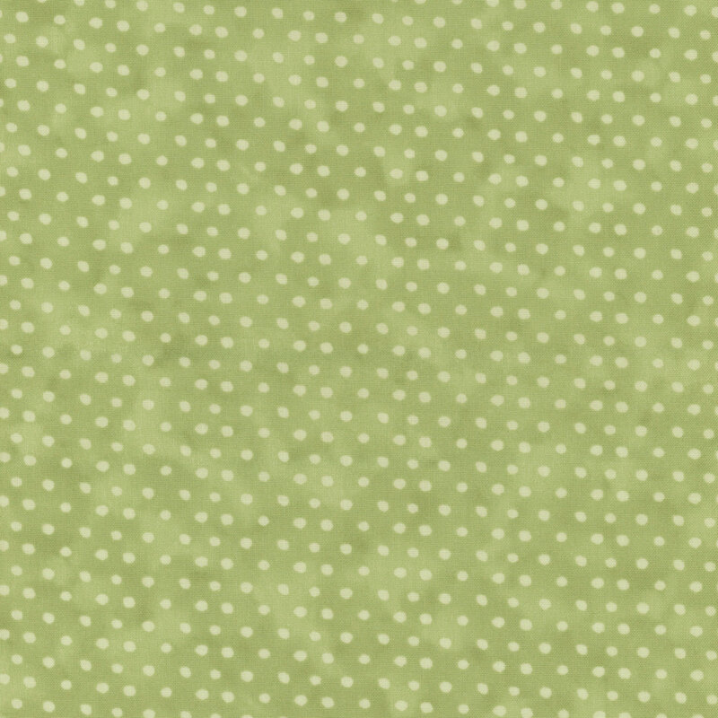 Sage green fabric featuring a light green polkadot pattern