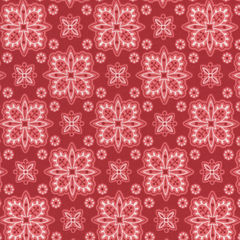 Barn red fabric with geometric floral shapes creating a checker-like pattern