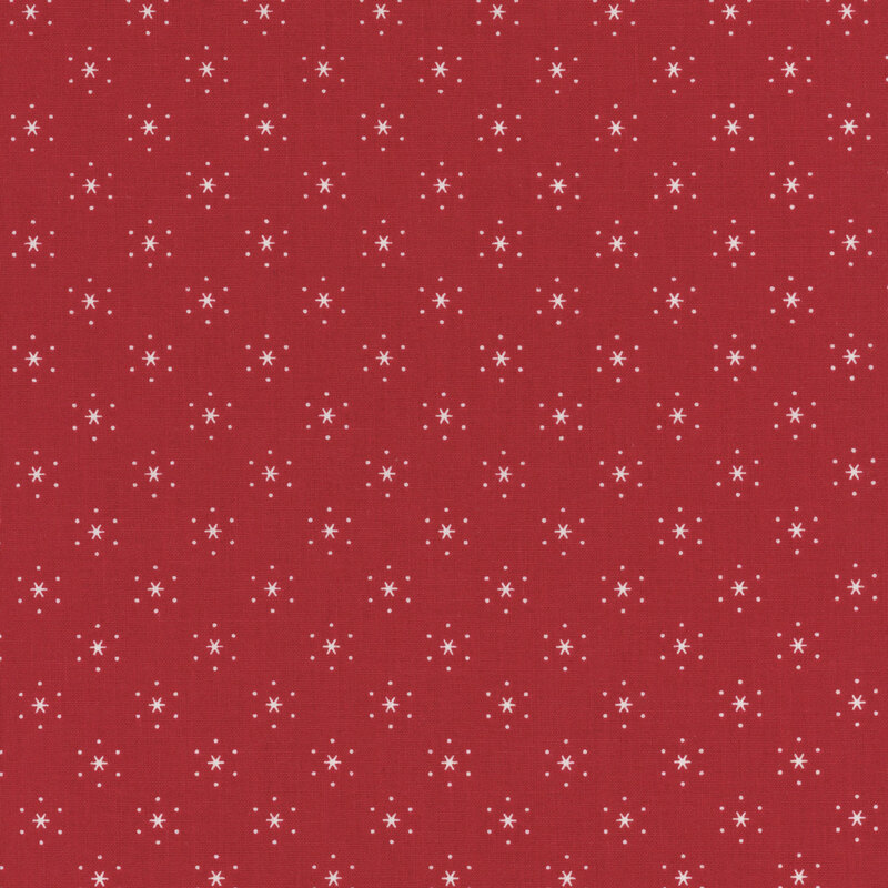 Barn red fabric with small, white, evenly spaced stars that are surrounded by little white polka dots