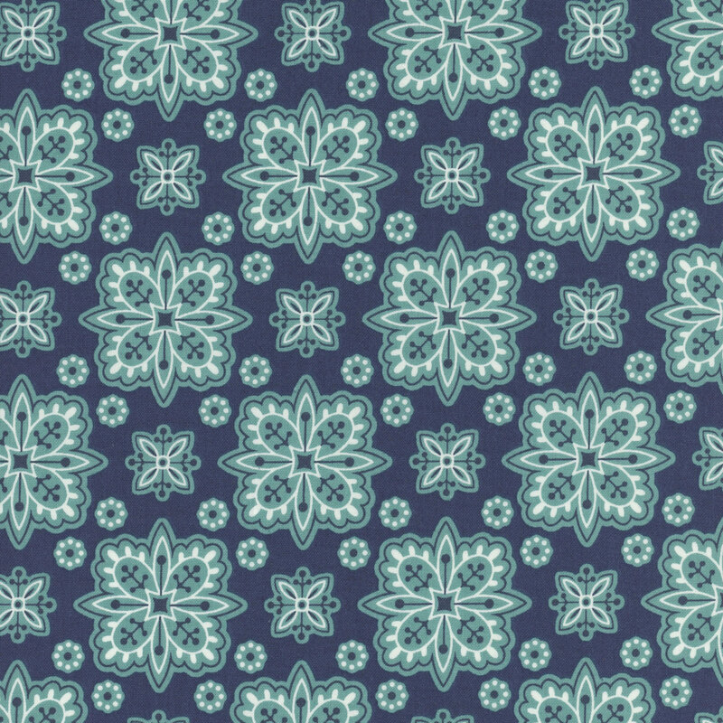 Denim blue fabric with geometric floral shapes creating a checker-like pattern