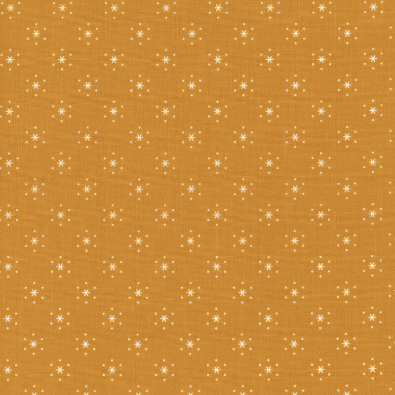 Caramel-colored fabric with small, white, evenly spaced stars that are surrounded by little white polka dots