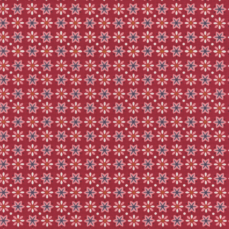 Barn red fabric featuring small pink, white, and blue stars and flowers in alternating patterns