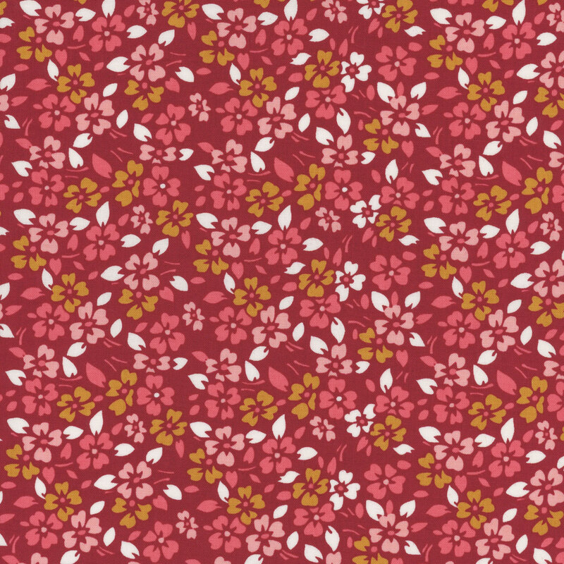 Barn red fabric covered in small yellow, pink, and red flowers with little white leaves