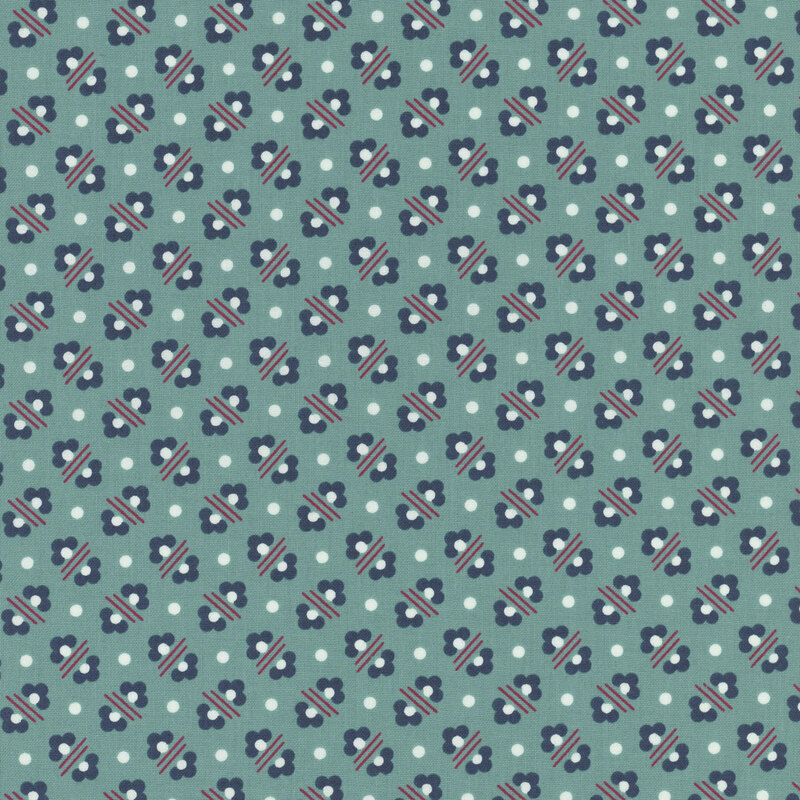 Teal fabric featuring little navy blue flowers arranged in alternating patterns and small white polka dots