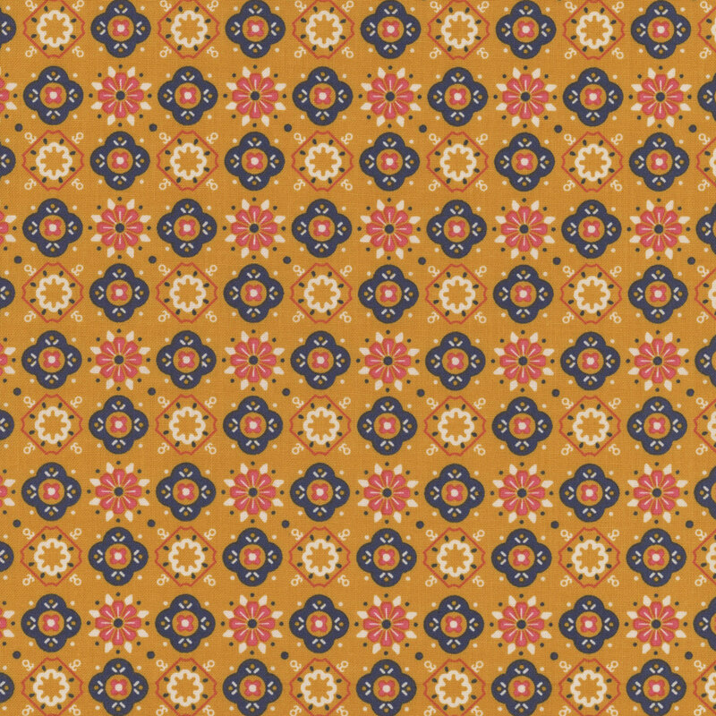 Caramel-colored fabric featuring alternating geometric floral shapes in pink, cream, and navy blue