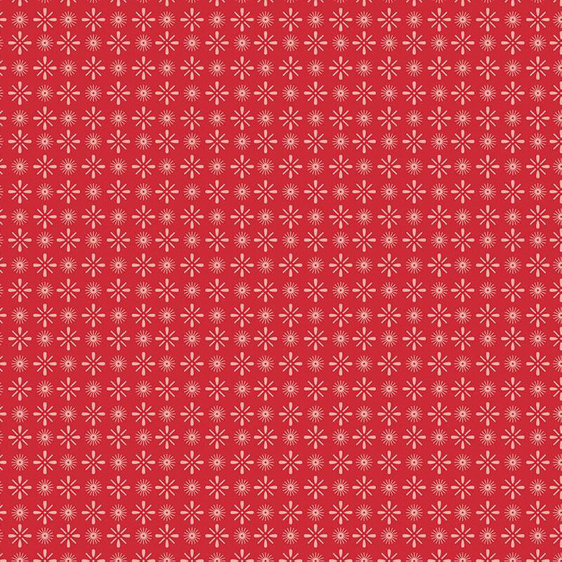 Barn red fabric with light pink, alternating, circular and diamond shaped star bursts