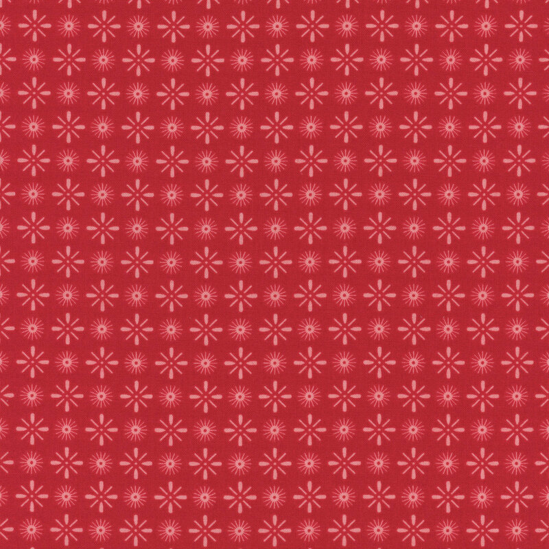 Barn red fabric with light pink, alternating, circular and diamond shaped star bursts