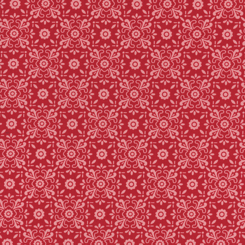 Barn red fabric with tonal, ornamental floral shapes making a lattice pattern throughout