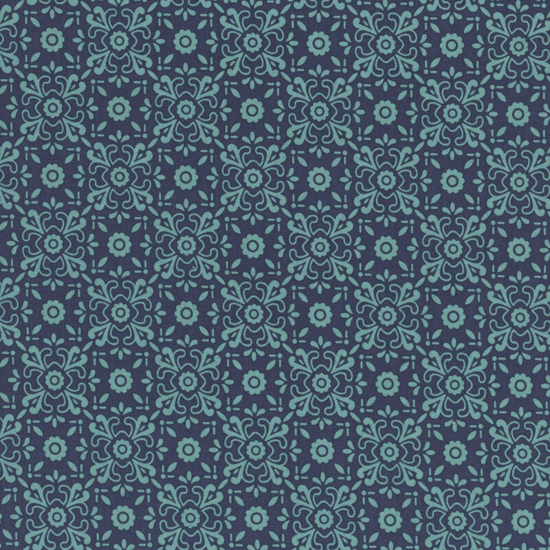 Dark denim blue fabric with tonal, ornamental floral designs making a lattice pattern