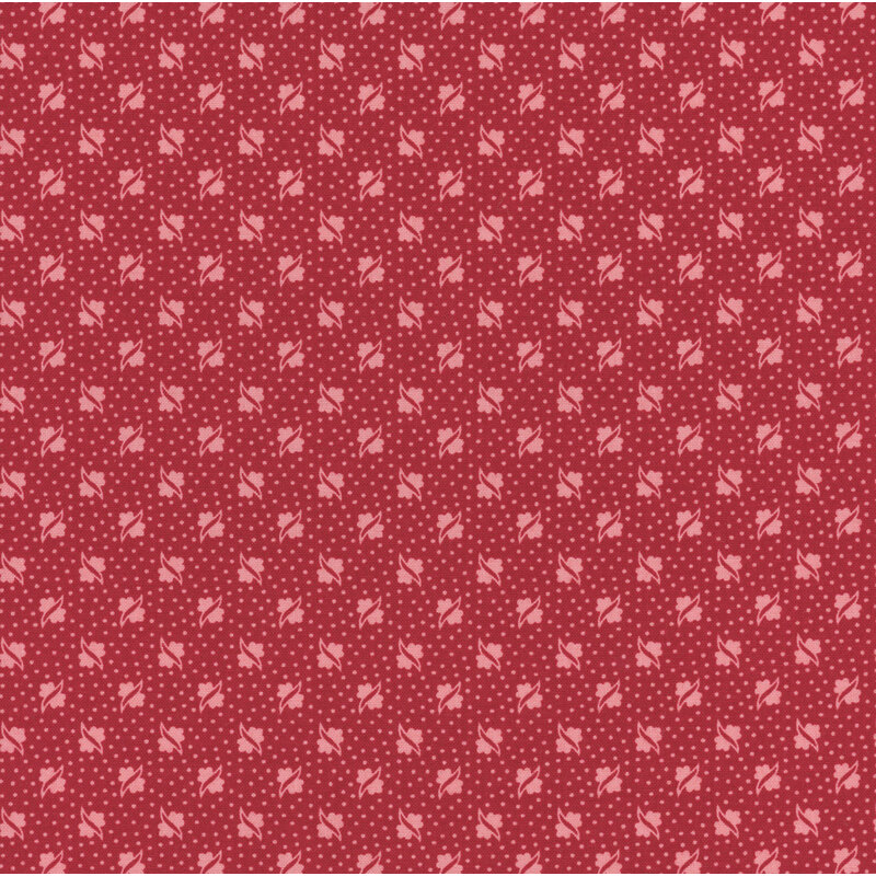 Barn red fabric with small, tonal, alternating floral shapes and light red pin dots all over