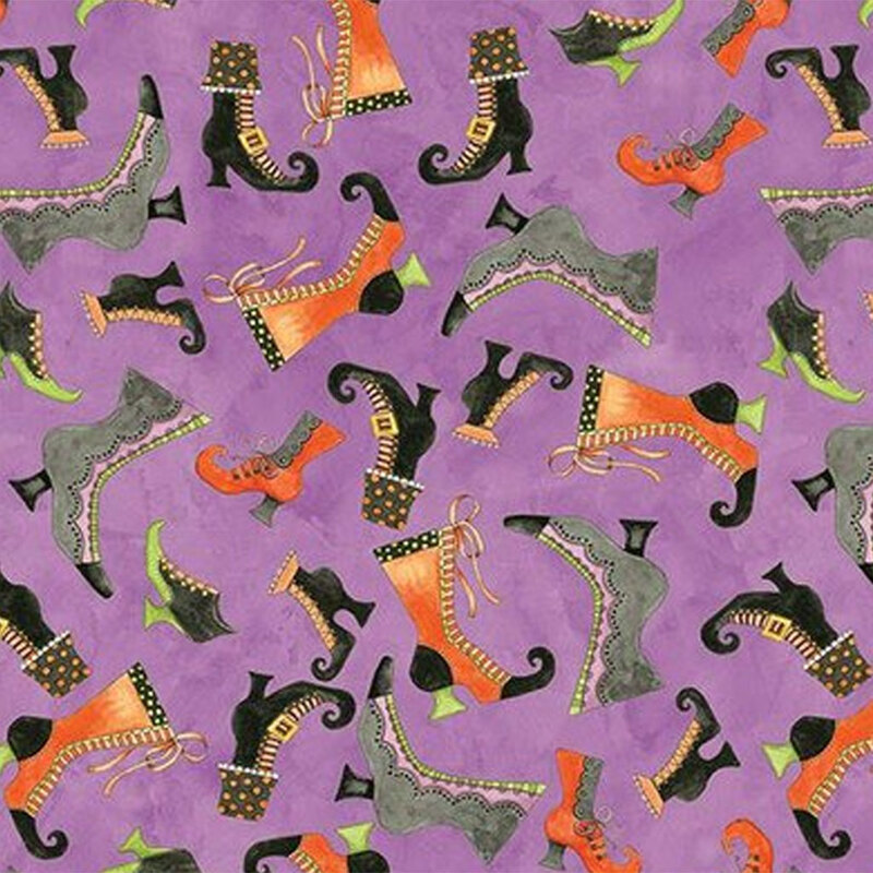 Mottled purple fabric with tossed halloween boots