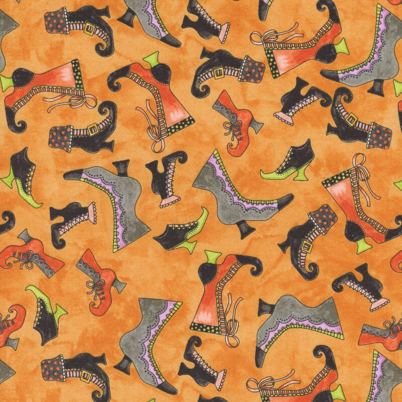 Mottled orange fabric with tossed halloween boots