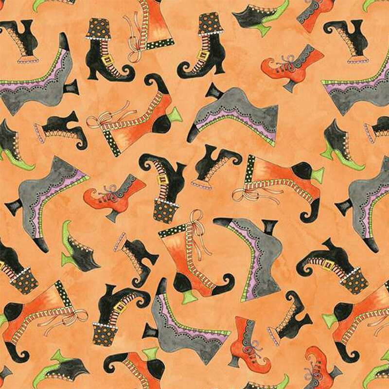 Mottled orange fabric with tossed halloween boots