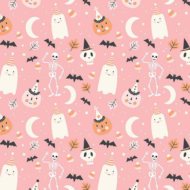 Pink fabric with tossed pumpkins, ghosts, skeletons, and other Halloween motifs.