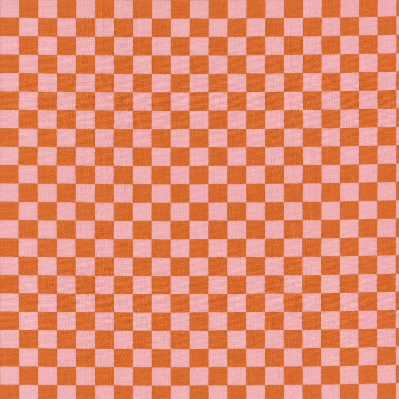 Pink and orange fabric in a small checkerboard pattern.