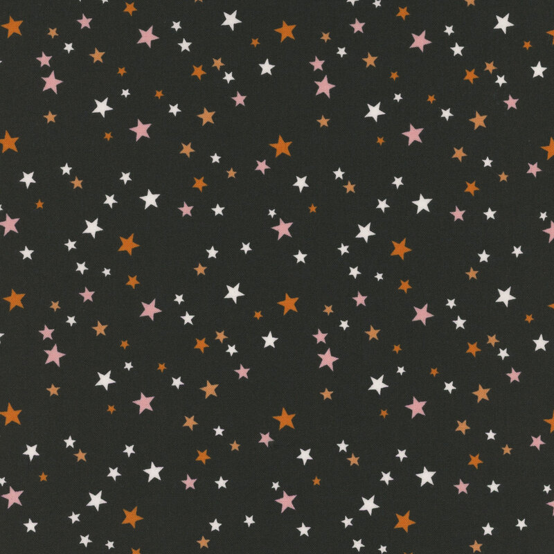 Black fabric with scattered stars in Halloween colors and pink.