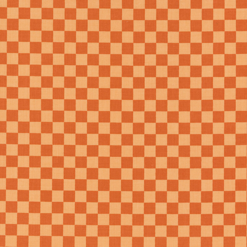 Tonal orange fabric in a small checkerboard pattern.