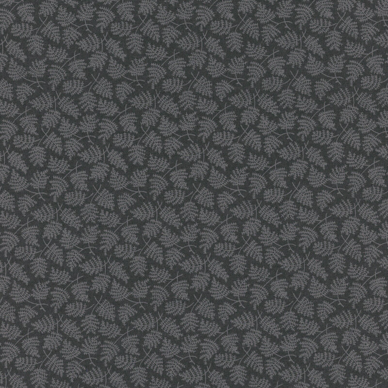 Gray-blue fabric with a tonal fern pattern scattered across the foreground