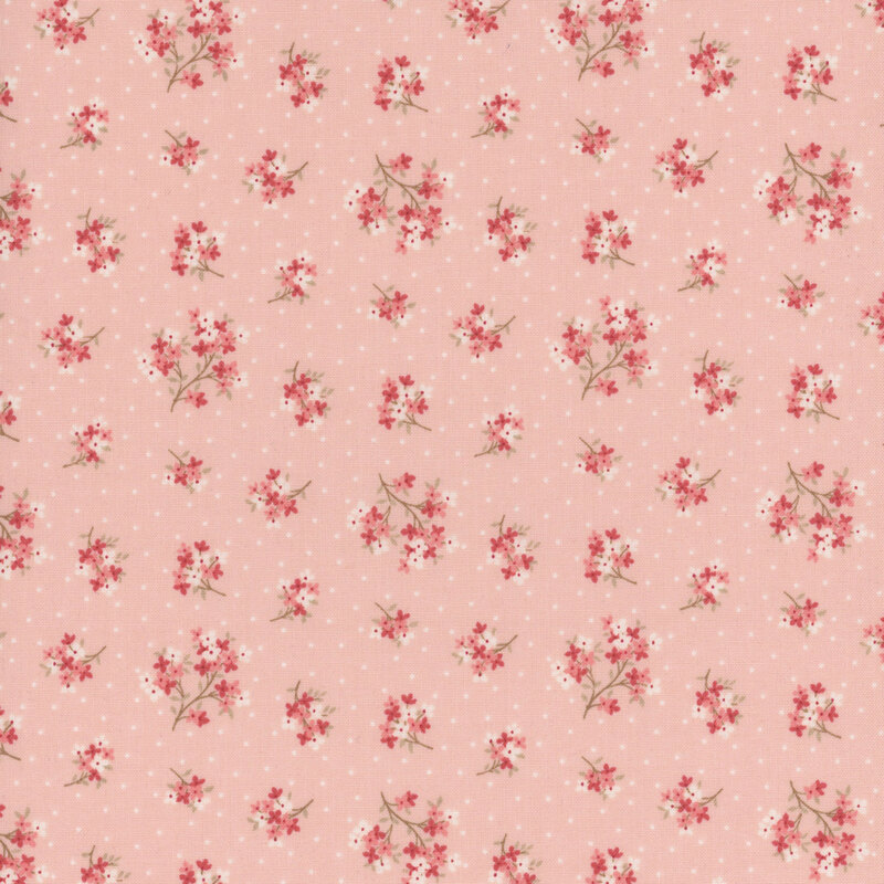 Light pink fabric featuring a pattern of floral clusters