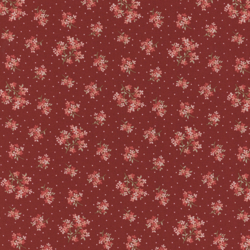 Red fabric featuring a pattern of floral clusters