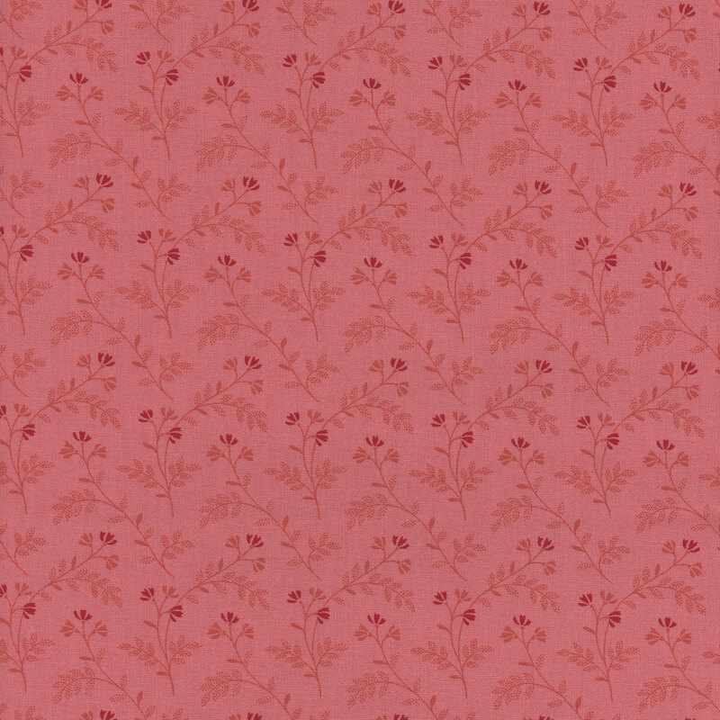 Tonal pink fabric featuring a pattern of delicate florals