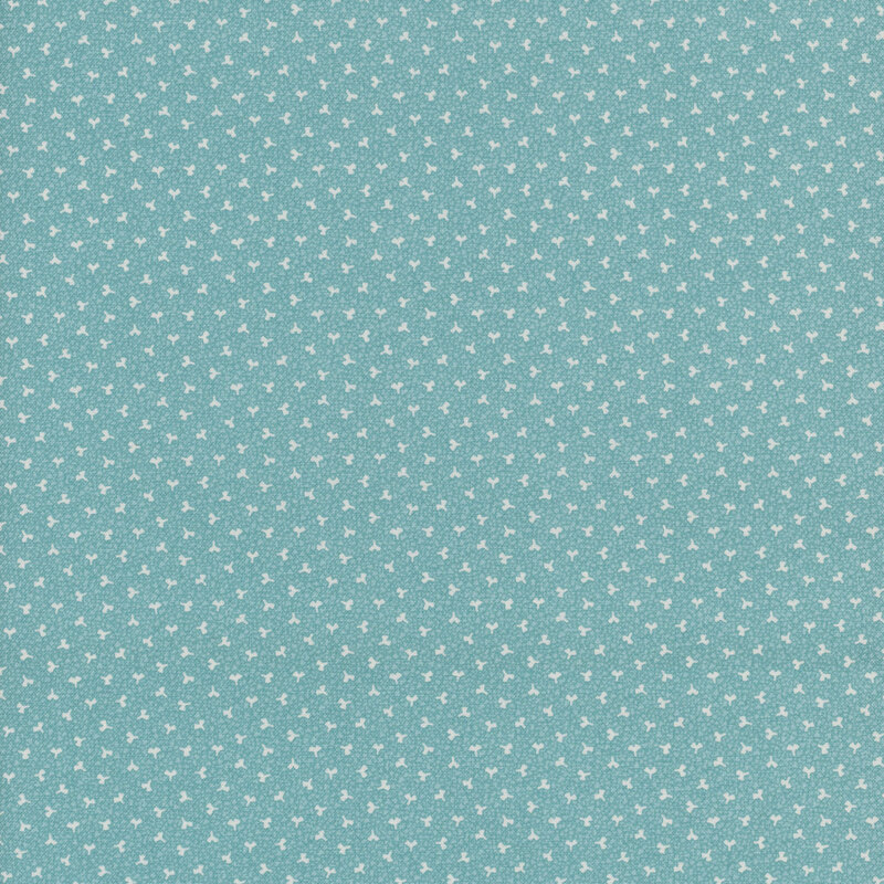 Light aqua fabric featuring tiny floral motifs