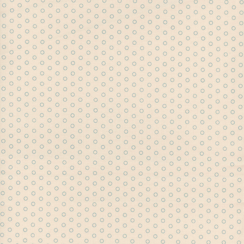 Cream fabric featuring aqua polka dots