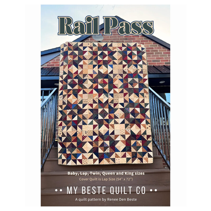 The front of the Rail Pass pattern featuring the finished quilt being held up by someone on a set of stairs leading up to a brick home.