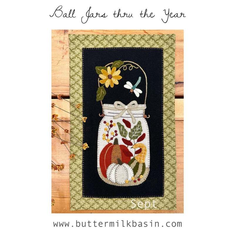 Front cover of the pattern showing the completed project on a rustic wood surface.