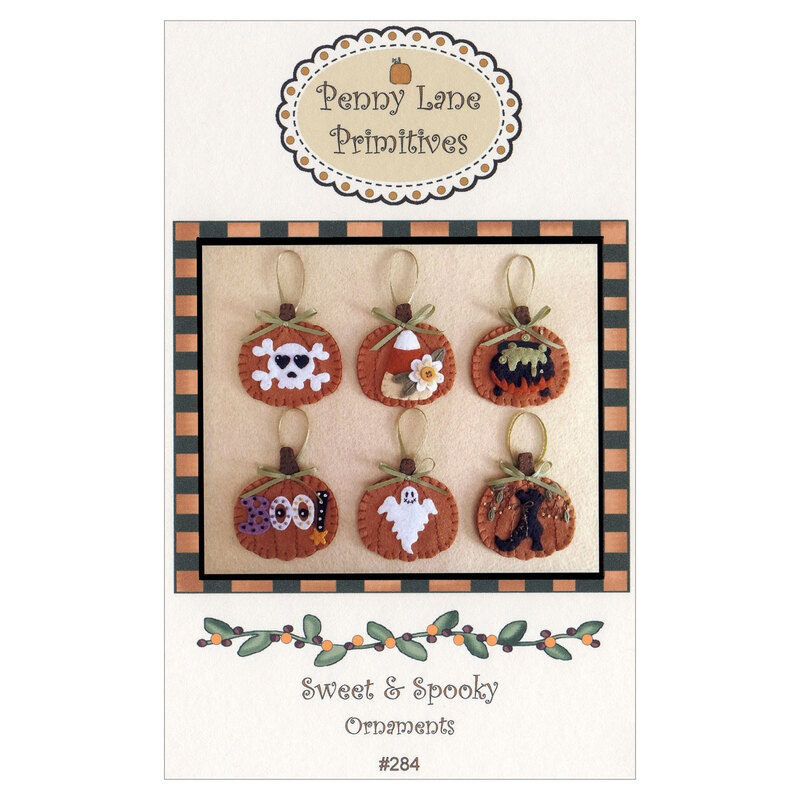 The front of the Sweet & Spooky Ornaments pattern featuring the finished ornaments displayed on a cream background.