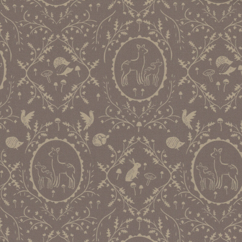 Gray brown fabric with leaves and vines in a damask pattern surrounding forest animals.