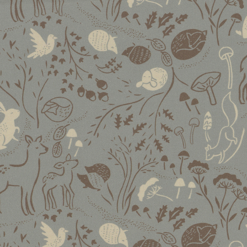 Gray fabric with scattered forest animals like deer, hedgehogs, foxes, and rabbits amongst trees, leaves, and mushrooms.