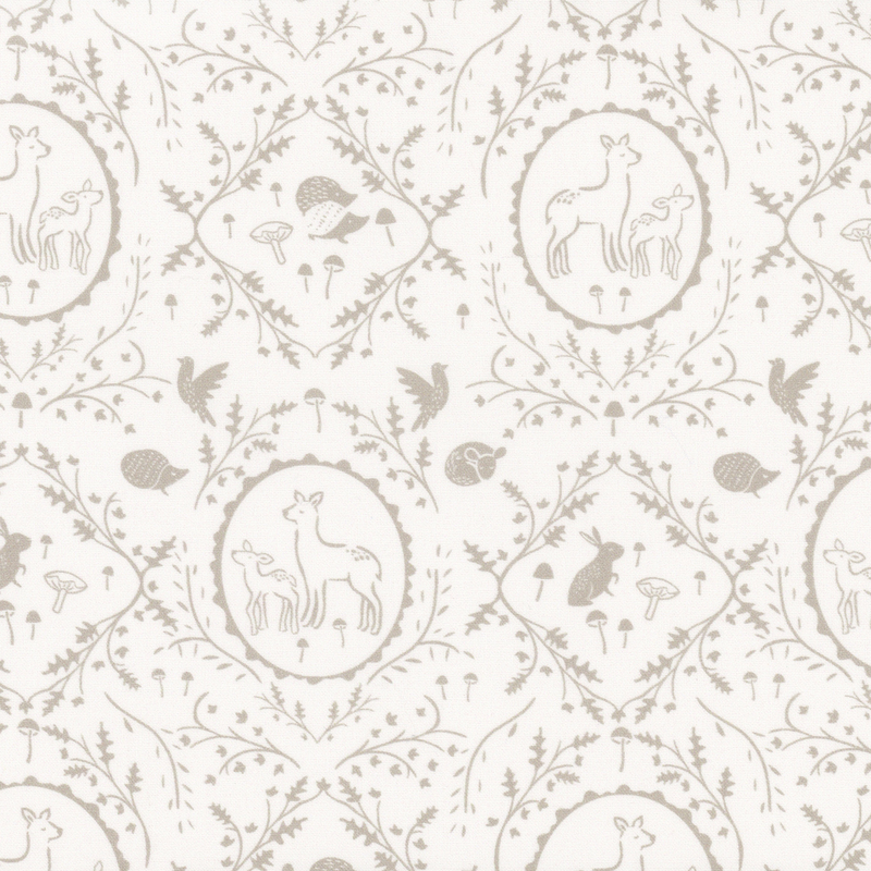 Off-white fabric with leaves and vines in a damask pattern surrounding forest animals.