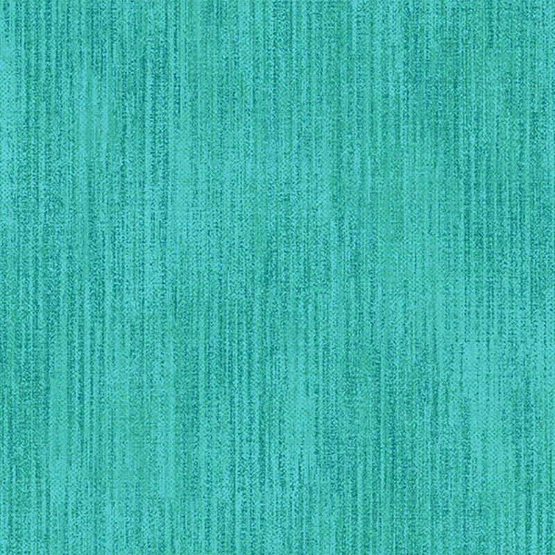 Turquoise quilting fabric with a grunge texture pattern throughout