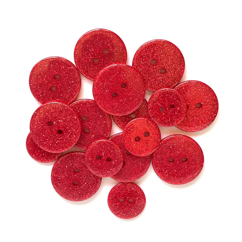 Pile of red glitter buttons against a white background