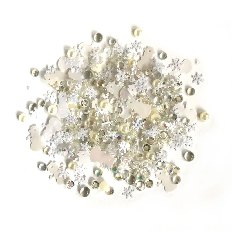 Pile of iridescent embellishments against a white background