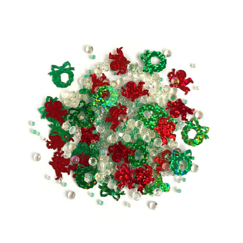 Pile of red, green, and iridescent embellishments against a white background