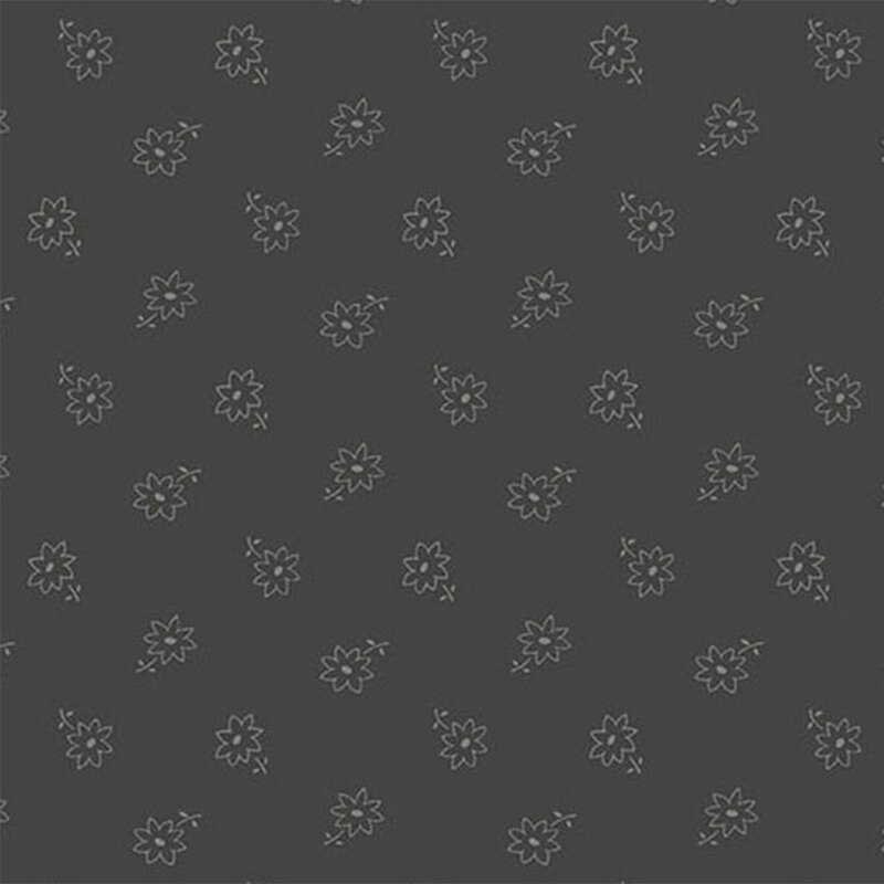 Dark grey fabric with a spinning flower pattern 