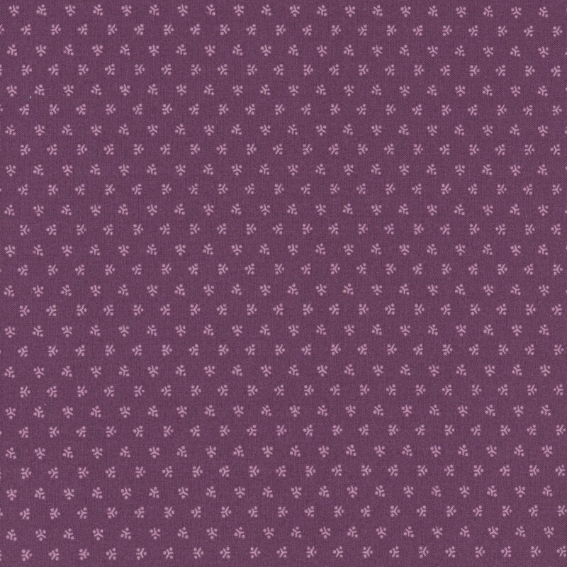 A purple fabric with a repeating pattern of tonal tokens.