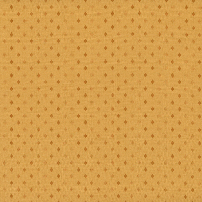 A golden yellow fabric with tonal geometric clusters