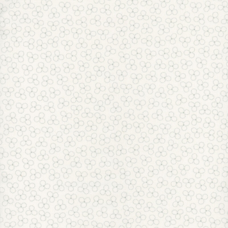 A tonal white fabric with a trefoil pattern