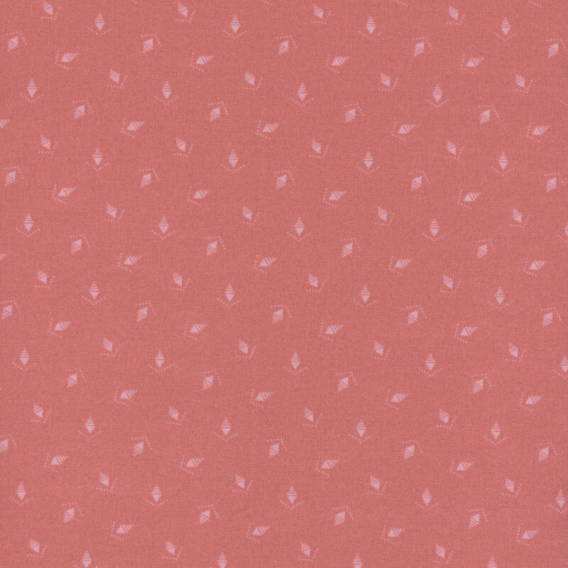 A rose pink fabric with tonal ditsy pinecones