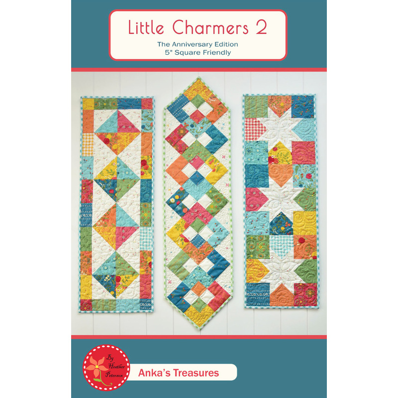 The front of the Little Charmers II pattern showing the finished table runners on a cream paneled background.