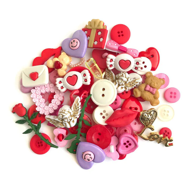 A pile of Valentine themed buttons and embellishments in red, pink, and white, featuring hearts, roses, and playful shapes.