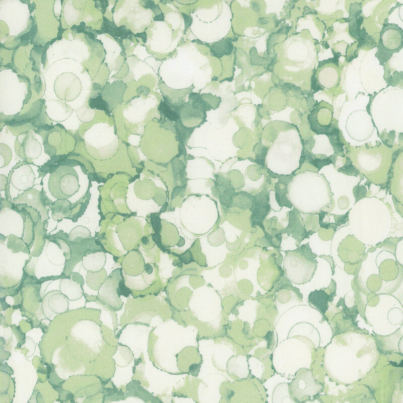 Green and cream watercolor blobs featuring overlapping circles and soft textures throughout