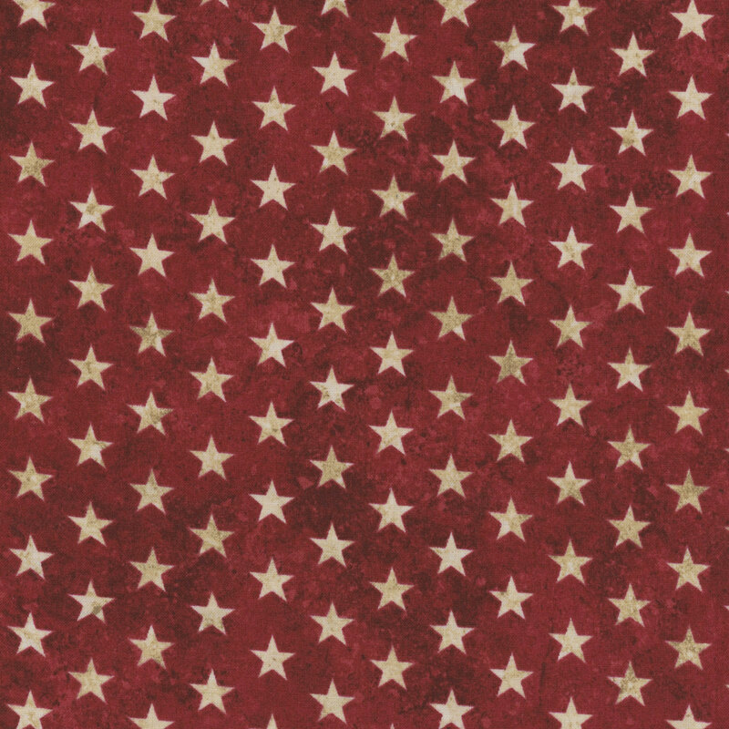 Red velvet fabric with a uniform pattern of cream stars.