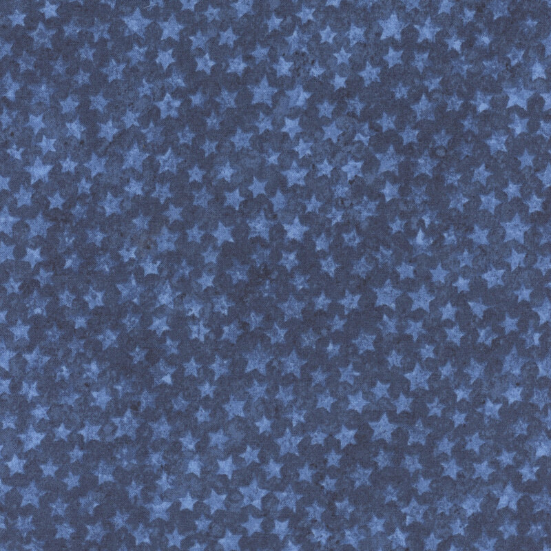 Blue fabric with a pattern of overlapping dark and light blue stars.